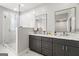 Bright bathroom with a dual vanity, a glass shower, and marble countertops at 90 Oak Walk, Villa Rica, GA 30180