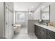 Bright bathroom with a soaking tub, a glass shower, and marble countertops at 90 Oak Walk, Villa Rica, GA 30180
