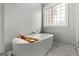 Bathroom features a soaking tub with a view from the window at 90 Oak Walk, Villa Rica, GA 30180