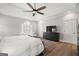 Beautiful primary bedroom features include tray ceilings, a ceiling fan, and wood flooring at 90 Oak Walk, Villa Rica, GA 30180