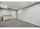 Basement bedroom offers neutral paint, light gray carpet and white dresser at 90 Oak Walk, Villa Rica, GA 30180