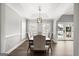 Elegant dining room with natural light, crown moulding, and classic decor at 90 Oak Walk, Villa Rica, GA 30180