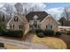 Charming brick home featuring manicured landscaping and a welcoming front entrance at 90 Oak Walk, Villa Rica, GA 30180