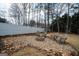 Cozy backyard fire pit area surrounded by gravel and chairs, perfect for relaxing outdoors at 90 Oak Walk, Villa Rica, GA 30180