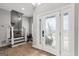 Bright foyer with decorative glass door and staircase leading upstairs at 90 Oak Walk, Villa Rica, GA 30180
