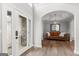 Elegant foyer with decorative glass door and archway leading to the living area at 90 Oak Walk, Villa Rica, GA 30180