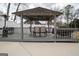 Charming backyard gazebo with seating and grilling area, perfect for outdoor dining at 90 Oak Walk, Villa Rica, GA 30180