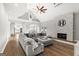 Spacious living room featuring a stone fireplace, wood floors, and open layout to the kitchen at 90 Oak Walk, Villa Rica, GA 30180