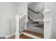 Staircase features dark metal spindles and wood-capped railings at 90 Oak Walk, Villa Rica, GA 30180