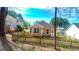 Cozy backyard with a well-maintained lawn, wooden fence, and a view of neighboring houses at 136 Glynn Addy Dr, Stockbridge, GA 30281