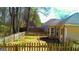 Fenced backyard features green grass and access to the home at 136 Glynn Addy Dr, Stockbridge, GA 30281