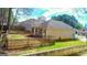 Fenced-in backyard with green grass and a detached home at 136 Glynn Addy Dr, Stockbridge, GA 30281