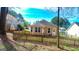 Fenced backyard with an in-ground planting area and a detached home at 136 Glynn Addy Dr, Stockbridge, GA 30281