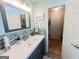 Nicely decorated bathroom vanity with stylish mosaic backsplash and modern faucet at 136 Glynn Addy Dr, Stockbridge, GA 30281