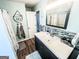 Bright bathroom with a dark vanity, vessel sink, and modern fixtures at 136 Glynn Addy Dr, Stockbridge, GA 30281