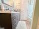 Bathroom featuring a gray vanity and a tiled backsplash at 136 Glynn Addy Dr, Stockbridge, GA 30281