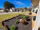 Front yard with mulch beds, mature plantings, and a view of the friendly neighborhood at 136 Glynn Addy Dr, Stockbridge, GA 30281