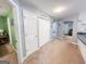 Hallway featuring two closets, adjacent to a laundry room and leading to other rooms at 136 Glynn Addy Dr, Stockbridge, GA 30281