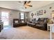 Spacious living room with leather sofas, neutral decor, and lots of natural light at 136 Glynn Addy Dr, Stockbridge, GA 30281