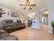 Inviting living room with neutral walls, ceiling fan, and comfortable leather sofas at 136 Glynn Addy Dr, Stockbridge, GA 30281