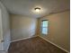 Neutral bedroom featuring plush carpeting, one window and ample wall space for decor at 741 S Fairfield Dr, Peachtree City, GA 30269