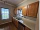 Kitchen with stainless steel appliances, hardwood floors, wood cabinets, and double sinks at 741 S Fairfield Dr, Peachtree City, GA 30269