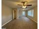 Large carpeted bedroom features a ceiling fan, closet and three windows at 1643 Columbia Dr, Decatur, GA 30032