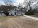 Cozy home featuring a well-manicured front yard and a private driveway at 1643 Columbia Dr, Decatur, GA 30032