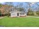 Charming single-story home with a well-maintained lawn and paved driveway at 1643 Columbia Dr, Decatur, GA 30032