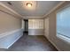 Cozy living room featuring built-in shelving, carpeted floors, and plenty of natural light at 1643 Columbia Dr, Decatur, GA 30032