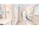 Bright bathroom featuring double vanities, tile flooring, and neutral color palette at 2455 Westlington Cir, Cumming, GA 30040