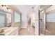 Bright bathroom boasting tile flooring, double sink vanity, and a glass-enclosed shower at 2455 Westlington Cir, Cumming, GA 30040