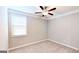 Bedroom with neutral walls and carpet with a ceiling fan and window at 2455 Westlington Cir, Cumming, GA 30040