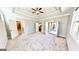 Expansive bedroom with tray ceilings, carpet, ample natural light, and access to a walk-in closet at 2455 Westlington Cir, Cumming, GA 30040
