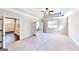 Large bedroom featuring neutral walls and access to an outdoor balcony at 2455 Westlington Cir, Cumming, GA 30040