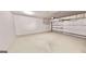 Spacious two-car garage featuring a sealed concrete floor and an automatic door opener at 2455 Westlington Cir, Cumming, GA 30040