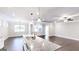 Stylish kitchen with a granite island, stainless steel appliances, and an open view to the living area at 2455 Westlington Cir, Cumming, GA 30040