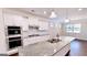Well-equipped kitchen featuring a large island, stainless steel appliances, granite countertops, and ample cabinet space at 2455 Westlington Cir, Cumming, GA 30040