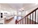 Open-concept living space with hardwood floors, a ceiling fan and a view of the modern kitchen at 2455 Westlington Cir, Cumming, GA 30040