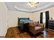 Stylish bedroom with hardwood floors, tray ceiling, and elegant furnishings at 105. Meadow Springs Ct, Locust Grove, GA 30248