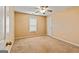 Standard bedroom featuring neutral walls, carpet flooring, and a ceiling fan at 105. Meadow Springs Ct, Locust Grove, GA 30248