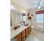 Bathroom featuring a decorative sink, granite countertop, and ample lighting, enhanced by neutral wall tones at 127 Circle H Rd, Sharpsburg, GA 30277