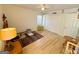 Cozy bedroom with light wood floors, bright window, and closet at 127 Circle H Rd, Sharpsburg, GA 30277