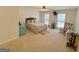 Bright main bedroom with plush carpeting, ceiling fan, and natural light from two windows at 127 Circle H Rd, Sharpsburg, GA 30277