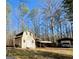 Outbuilding with lean-to sheds for additional storage and covered parking for your RV at 127 Circle H Rd, Sharpsburg, GA 30277