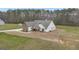 Aerial view of home with stone and white siding, and large green yard at 196 Old Highway 92, Fayetteville, GA 30215