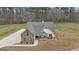 An aerial view showcasing the home's roof, stone exterior, and multiple garage doors with manicured landscaping at 196 Old Highway 92, Fayetteville, GA 30215