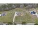 Aerial view showcases the home's exterior with a long driveway and the expansive surrounding land at 196 Old Highway 92, Fayetteville, GA 30215