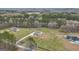 An aerial view of a gorgeous home and property in a rural setting surrounded by lush green trees and a massive lot at 196 Old Highway 92, Fayetteville, GA 30215