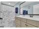 Bathroom with neutral color scheme, including shower with floral curtain, and vanity with a quartz countertop at 196 Old Highway 92, Fayetteville, GA 30215